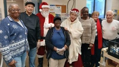 Santa and Mrs. Claus with Meals on Wheels Kitchen Staff