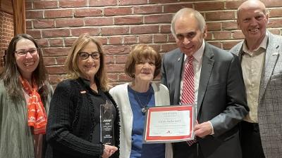 Carole receiving AARP Award